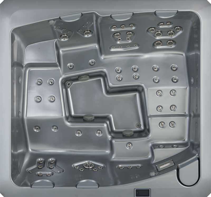 Vue de dessus d'un spa USSPA gris avec sièges ergonomiques et plusieurs zones de jets